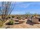 Custom outdoor fire pit and desert landscaping is perfect for entertaining at 13827 N Sunset Dr, Fountain Hills, AZ 85268