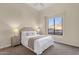 Bright bedroom with a large window, neutral tones, and cozy decor at 13827 N Sunset Dr, Fountain Hills, AZ 85268