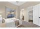 Inviting bedroom featuring a neutral palette, plush carpet, and ensuite bath and walk-in closet at 13827 N Sunset Dr, Fountain Hills, AZ 85268
