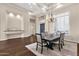 Spacious dining room boasts modern lighting, large windows, and an open floor plan at 13827 N Sunset Dr, Fountain Hills, AZ 85268
