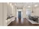 Open-concept dining area with a chandelier and decorative glass above the front door at 13827 N Sunset Dr, Fountain Hills, AZ 85268