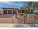 Exterior of the home featuring a paved driveway leading to a two-car garage in a desert landscape at 13827 N Sunset Dr, Fountain Hills, AZ 85268