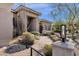 Paver walkway leads to a front entrance with desert landscaping at 13827 N Sunset Dr, Fountain Hills, AZ 85268