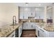 Well-appointed kitchen featuring granite countertops, modern appliances, and white cabinetry at 13827 N Sunset Dr, Fountain Hills, AZ 85268