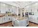 Bright kitchen featuring custom cabinets, granite countertops, stainless steel appliances, and a large island with a sink at 13827 N Sunset Dr, Fountain Hills, AZ 85268