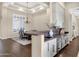 Open concept kitchen with granite countertop, modern wine fridge, and stylish cabinets at 13827 N Sunset Dr, Fountain Hills, AZ 85268