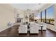 Cozy living room with a fireplace, neutral-toned furniture, and large windows offering natural light and views at 13827 N Sunset Dr, Fountain Hills, AZ 85268