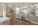 Large main bathroom with dual vanities, walk-in shower, and tile flooring at 13827 N Sunset Dr, Fountain Hills, AZ 85268