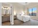 This relaxing main bedroom has a large window and adjoins to the main bath at 13827 N Sunset Dr, Fountain Hills, AZ 85268