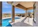 Covered patio overlooking the sparkling pool and desert landscape offers shade and outdoor living at 13827 N Sunset Dr, Fountain Hills, AZ 85268