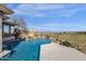 This stunning backyard includes a pool with rock waterfall and picturesque desert views, creating a serene escape at 13827 N Sunset Dr, Fountain Hills, AZ 85268