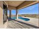 The covered patio provides an ideal vantage point of the pristine pool, which is perfect for relaxation and entertainment at 13827 N Sunset Dr, Fountain Hills, AZ 85268