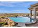 This backyard paradise offers a beautiful pool and views that seamlessly blends with the natural desert landscape at 13827 N Sunset Dr, Fountain Hills, AZ 85268