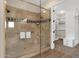 Walk-in shower featuring tile surround and glass door at 13827 N Sunset Dr, Fountain Hills, AZ 85268