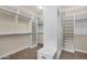 Custom walk-in closet with built in shelves and drawers at 13827 N Sunset Dr, Fountain Hills, AZ 85268