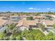 An aerial view of the home shows the grassy back yard with covered patio at 14955 N 78Th Dr, Peoria, AZ 85381