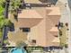 An aerial view of a home with an attractive brown tile roof and a backyard oasis with a pool at 14955 N 78Th Dr, Peoria, AZ 85381