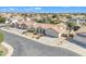 An aerial view of a single story home with a beautiful exterior and a well-kept lawn with nice landscaping at 14955 N 78Th Dr, Peoria, AZ 85381