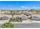 An aerial view of the home shows its beautiful landscaping, and a three-car garage at 14955 N 78Th Dr, Peoria, AZ 85381