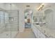 Bright bathroom with shower and double sink vanity leading to bedroom at 14955 N 78Th Dr, Peoria, AZ 85381