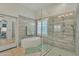 Bathroom with modern tile work, separate tub and glass-enclosed shower at 14955 N 78Th Dr, Peoria, AZ 85381