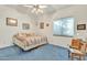 Bedroom featuring ceiling fan, blue carpet, and a window with blind at 14955 N 78Th Dr, Peoria, AZ 85381