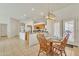 Bright dining area with wood table, chairs and stylish modern chandelier at 14955 N 78Th Dr, Peoria, AZ 85381