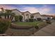 Beautiful home showcasing lush landscaping and a well-maintained lawn at 14955 N 78Th Dr, Peoria, AZ 85381