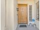 Welcoming front entry featuring a solid wood door and security system at 14955 N 78Th Dr, Peoria, AZ 85381