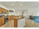 Open kitchen featuring stainless steel appliances, a center island, and seamless flow to the living space at 14955 N 78Th Dr, Peoria, AZ 85381