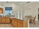 Kitchen island with granite countertops, stainless steel dishwasher, and a breakfast nook nearby at 14955 N 78Th Dr, Peoria, AZ 85381