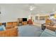 Open living room with tile flooring and seamless access to the kitchen and dining areas at 14955 N 78Th Dr, Peoria, AZ 85381