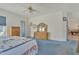 Bright bedroom with natural wood furniture and access to a bathroom at 14955 N 78Th Dr, Peoria, AZ 85381