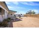 Spacious backyard featuring a quaint patio, grill and low-maintenance landscaping; perfect for entertaining and relaxing outdoors at 1510 S Lawther Dr, Apache Junction, AZ 85120