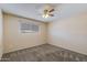 Bedroom with neutral carpeting and a ceiling fan at 1510 S Lawther Dr, Apache Junction, AZ 85120