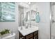 This bathroom boasts modern fixtures and a serene ambiance, enhanced by stylish decor and neutral tones at 15262 W Garfield St, Goodyear, AZ 85338