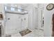 This bathroom features a frameless glass shower with gray tile at 15262 W Garfield St, Goodyear, AZ 85338