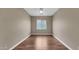 Bedroom featuring hardwood floors, a window, and neutral colored walls at 16966 W Rio Vista Ln, Goodyear, AZ 85338