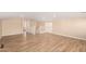 Spacious bonus room with wood-look flooring and neutral paint at 16966 W Rio Vista Ln, Goodyear, AZ 85338