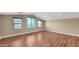Spacious bonus room features hardwood floors, neutral walls, and lots of natural light at 16966 W Rio Vista Ln, Goodyear, AZ 85338