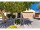 Charming single-Gathering home featuring a well-manicured front yard and a two-car garage at 16966 W Rio Vista Ln, Goodyear, AZ 85338