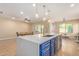 Spacious kitchen island with counter seating and a modern faucet at 16966 W Rio Vista Ln, Goodyear, AZ 85338