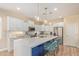 Modern kitchen featuring pendant lighting and a center island with seating at 16966 W Rio Vista Ln, Goodyear, AZ 85338
