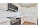 Well-equipped kitchen with stainless steel appliances, quartz countertops, and modern tile backsplash at 16966 W Rio Vista Ln, Goodyear, AZ 85338