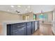 Spacious kitchen featuring a large island with stainless steel appliances and sleek cabinetry at 16966 W Rio Vista Ln, Goodyear, AZ 85338