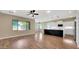Spacious living area with hardwood floors and natural light, leading into the kitchen at 16966 W Rio Vista Ln, Goodyear, AZ 85338