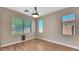 Inviting living room with hardwood floors and abundant natural light streaming through multiple windows at 16966 W Rio Vista Ln, Goodyear, AZ 85338