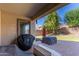 Covered patio featuring a brick floor is perfect for outdoor entertaining and grilling at 16966 W Rio Vista Ln, Goodyear, AZ 85338