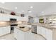 Modern kitchen with stainless steel appliances, granite countertops, and ample cabinet space at 17204 W Cordova Ct, Surprise, AZ 85387