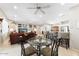 Open concept living room with bar, dining room and seating area at 17204 W Cordova Ct, Surprise, AZ 85387